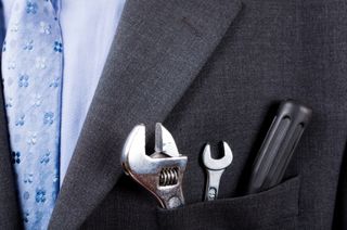 Here's an alt tag for the image: `Tools in a suit pocket`