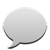 A white speech bubble sitting on top of a table.