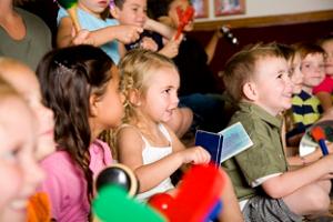 Here's an alt tag for the image: Preschool children playing musical instruments.