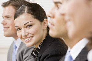 A group of people sitting in front of each other.