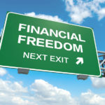 A road sign with financial freedom words on sky background