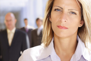 Confident businesswoman, serious expression.