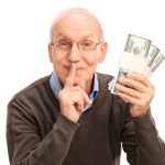 Here's a short alt tag for the image: `Senior man holding money, keeping secret.`